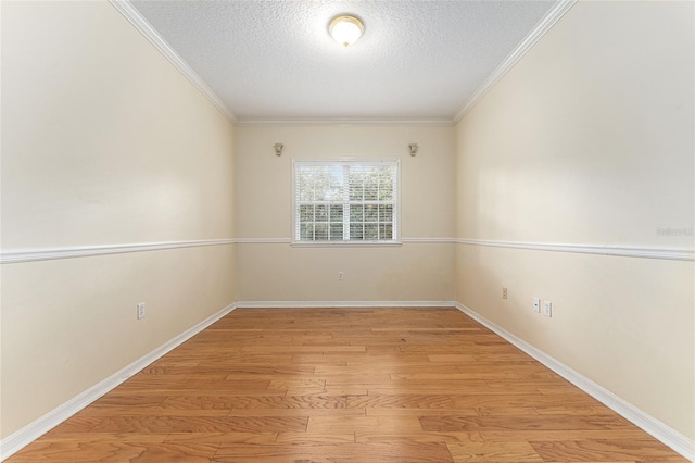8036 SW 72nd Pl, Gainesville, FL 32608 - empty room with a textured ceiling, light wood-style flooring, and ornamental molding