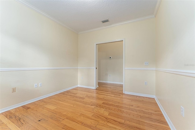 8036 SW 72nd Pl, Gainesville, FL 32608 - spare room with ornamental molding, light wood-style floors, and a textured ceiling