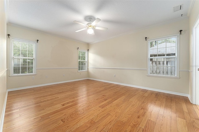 8036 SW 72nd Pl, Gainesville, FL 32608 - spare room with light wood-style flooring, a ceiling fan, ornamental molding, and healthy amount of natural light