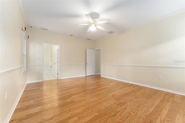 8036 SW 72nd Pl, Gainesville, FL 32608 - spare room featuring crown molding, a ceiling fan, and light wood-style flooring