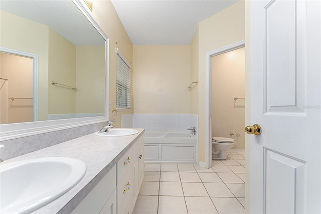 8036 SW 72nd Pl, Gainesville, FL 32608 - bathroom with tile patterned floors, a bath, double vanity, and a textured ceiling
