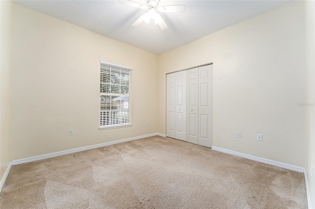 8036 SW 72nd Pl, Gainesville, FL 32608 - unfurnished bedroom featuring carpet, a closet, and ceiling fan