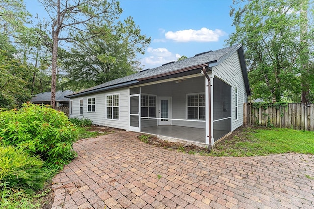 8036 SW 72nd Pl, Gainesville, FL 32608 - rear view of house with a sunroom and a patio