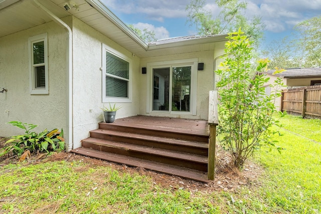 8488 NW 39th Ter, Gainesville, FL 32653 - doorway to property featuring stucco siding and a metal roof