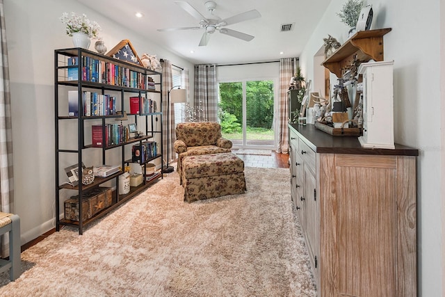 8488 NW 39th Ter, Gainesville, FL 32653 - sitting room with wood finished floors, ceiling fan, and recessed lighting