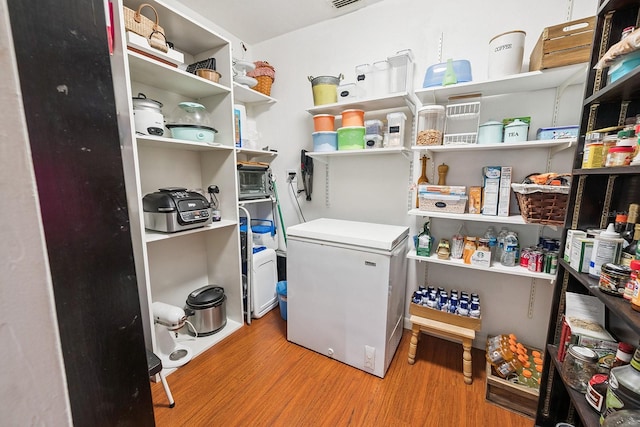 8488 NW 39th Ter, Gainesville, FL 32653 - laundry area with wood finished floors