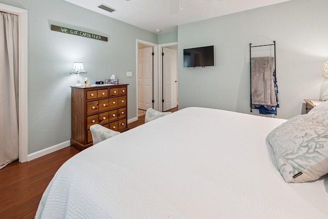 8488 NW 39th Ter, Gainesville, FL 32653 - bedroom with wood finished floors and a ceiling fan