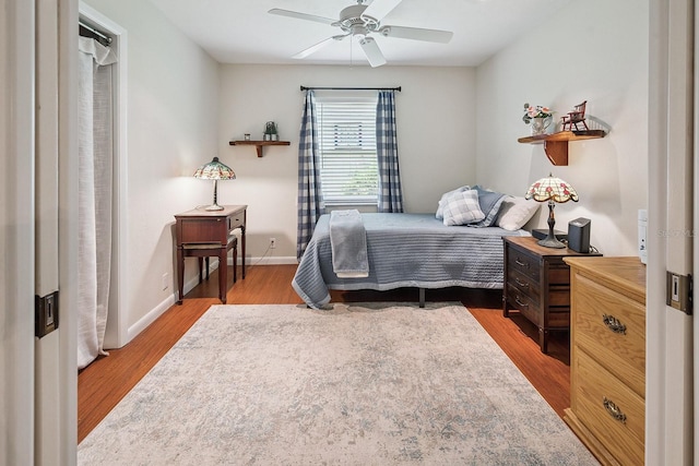 8488 NW 39th Ter, Gainesville, FL 32653 - bedroom with wood finished floors and ceiling fan