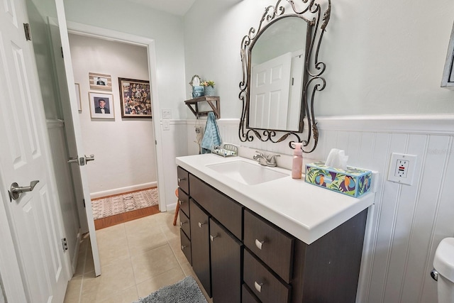 8488 NW 39th Ter, Gainesville, FL 32653 - bathroom with vanity, wainscoting, and tile patterned floors
