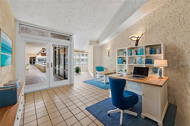 4555 S Atlantic Ave Unit 4603, Ponce Inlet, FL 32127 - office space with french doors, a textured wall, tile patterned floors, a textured ceiling, and built in study area