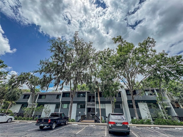 2710 SW 14th Dr, Gainesville, FL 32608 - view of building exterior with uncovered parking and stairway