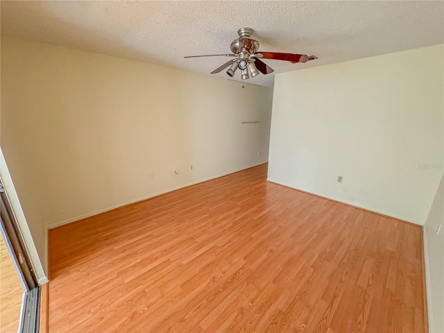 2710 SW 14th Dr, Gainesville, FL 32608 - spare room with a ceiling fan, light wood-type flooring, and a textured ceiling