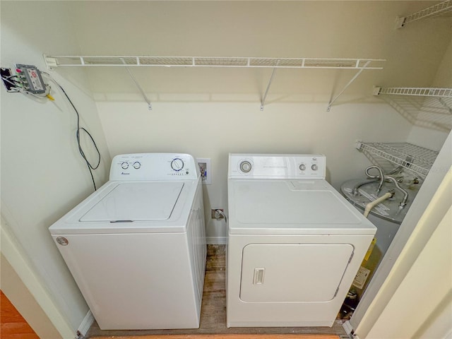 2710 SW 14th Dr, Gainesville, FL 32608 - laundry room with separate washer and dryer and wood finished floors