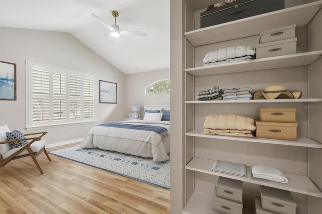 10549 NW 32nd Rd, Gainesville, FL 32606 - bedroom featuring wood finished floors, lofted ceiling, and ceiling fan