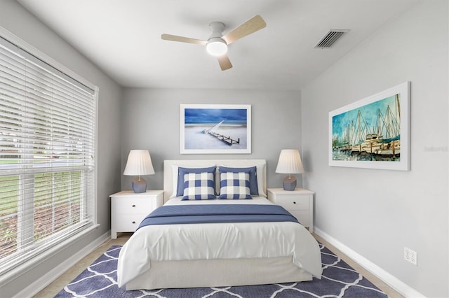 10549 NW 32nd Rd, Gainesville, FL 32606 - bedroom featuring baseboards and ceiling fan