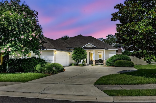 2750 NW 143rd Way, Newberry, FL 32669 - craftsman-style home featuring a garage, concrete driveway, a shingled roof, and covered porch