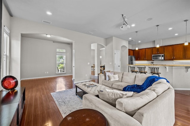 2750 NW 143rd Way, Newberry, FL 32669 - living area with arched walkways, wood finished floors, and recessed lighting