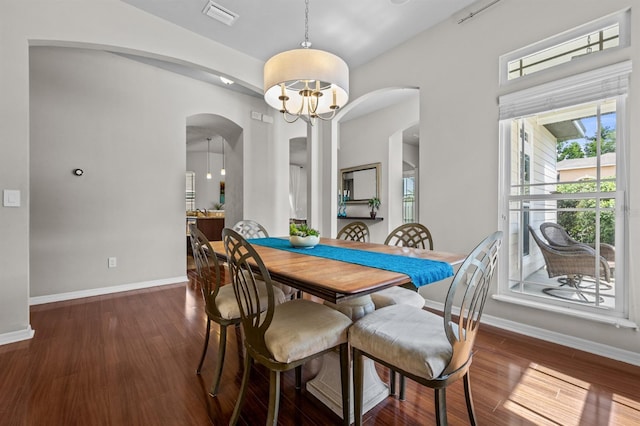 2750 NW 143rd Way, Newberry, FL 32669 - dining space featuring arched walkways, wood finished floors, and a chandelier