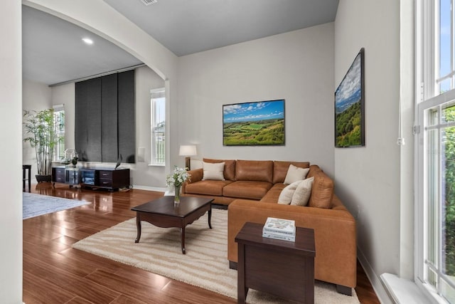 2750 NW 143rd Way, Newberry, FL 32669 - living room featuring arched walkways and wood finished floors