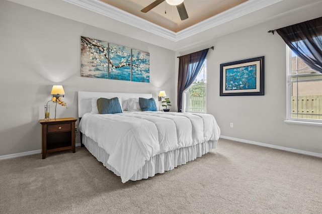 2750 NW 143rd Way, Newberry, FL 32669 - carpeted bedroom with ornamental molding, multiple windows, a ceiling fan, and a tray ceiling