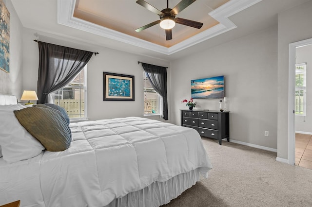 2750 NW 143rd Way, Newberry, FL 32669 - bedroom with a tray ceiling, light colored carpet, crown molding, and ceiling fan