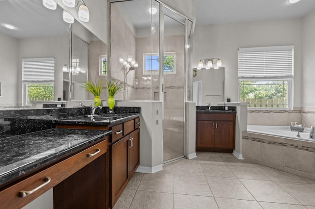 2750 NW 143rd Way, Newberry, FL 32669 - bathroom with plenty of natural light, two vanities, a garden tub, and tile patterned flooring