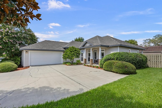 2750 NW 143rd Way, Newberry, FL 32669 - view of front of house with driveway, a garage, and a porch
