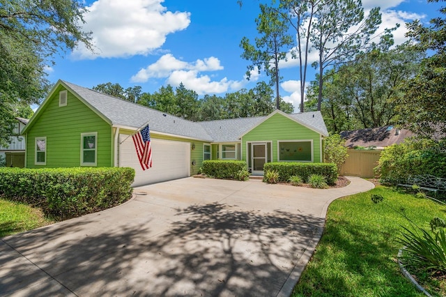 4705 SW 80th Ter, Gainesville, FL 32608 - ranch-style house featuring an attached garage, driveway, and roof with shingles