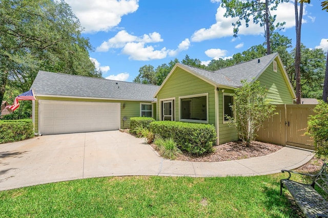 4705 SW 80th Ter, Gainesville, FL 32608 - ranch-style home with driveway, a garage, and roof with shingles