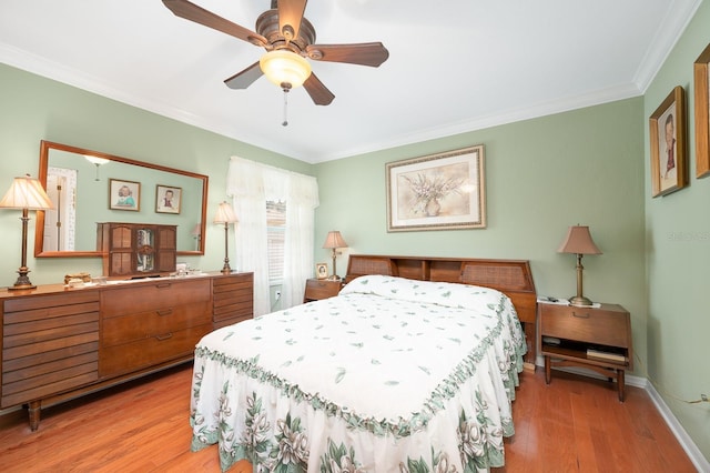 4705 SW 80th Ter, Gainesville, FL 32608 - bedroom featuring ornamental molding, light wood finished floors, and ceiling fan