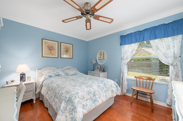 4705 SW 80th Ter, Gainesville, FL 32608 - bedroom with wood finished floors, ornamental molding, and a ceiling fan