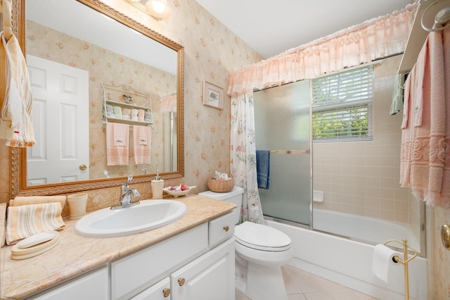 4705 SW 80th Ter, Gainesville, FL 32608 - bathroom with wallpapered walls, tile patterned flooring, vanity, and bath / shower combo with glass door