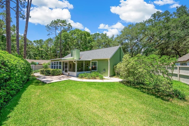 4705 SW 80th Ter, Gainesville, FL 32608 - view of front of house with a sunroom and a chimney