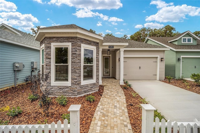 1080 NW 132nd Blvd, Newberry, FL 32669 - view of front of home with concrete driveway, an attached garage, and stone siding