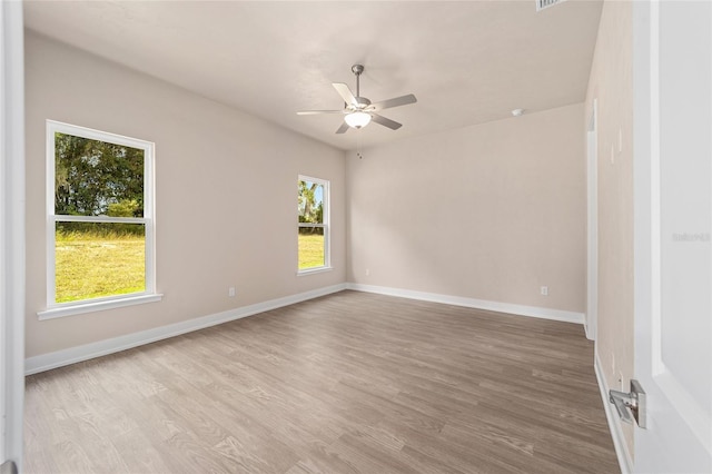 1080 NW 132nd Blvd, Newberry, FL 32669 - unfurnished room with ceiling fan, plenty of natural light, and wood finished floors