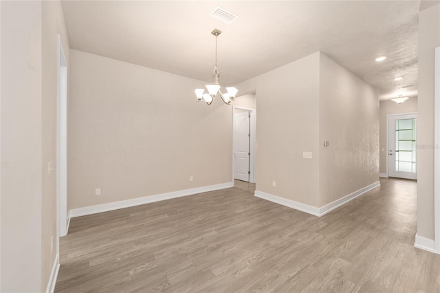 1080 NW 132nd Blvd, Newberry, FL 32669 - spare room featuring a chandelier, light wood-style floors, and recessed lighting