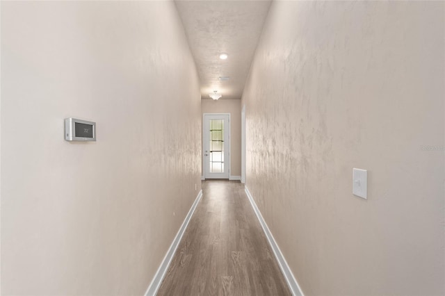 1080 NW 132nd Blvd, Newberry, FL 32669 - hall with dark wood-style flooring and baseboards