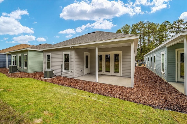 1080 NW 132nd Blvd, Newberry, FL 32669 - rear view of property featuring a yard, a patio, roof with shingles, and french doors