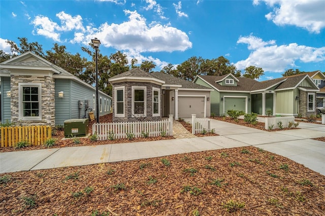 1080 NW 132nd Blvd, Newberry, FL 32669 - view of front facade featuring a fenced front yard, a garage, driveway, and stone siding