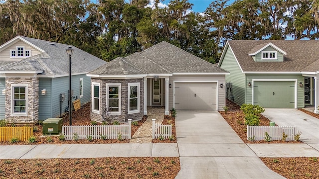 1080 NW 132nd Blvd, Newberry, FL 32669 - view of front facade with concrete driveway, a garage, and stone siding