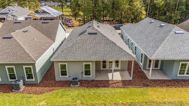1080 NW 132nd Blvd, Newberry, FL 32669 - rear view of property featuring a patio, a yard, a residential view, and a shingled roof