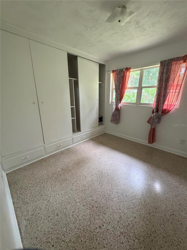 1215 NE 21st Ave, Gainesville, FL 32609 - empty room with a textured ceiling and speckled floor
