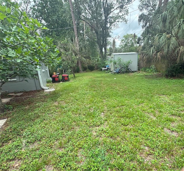 1215 NE 21st Ave, Gainesville, FL 32609 - view of green lawn featuring a storage unit