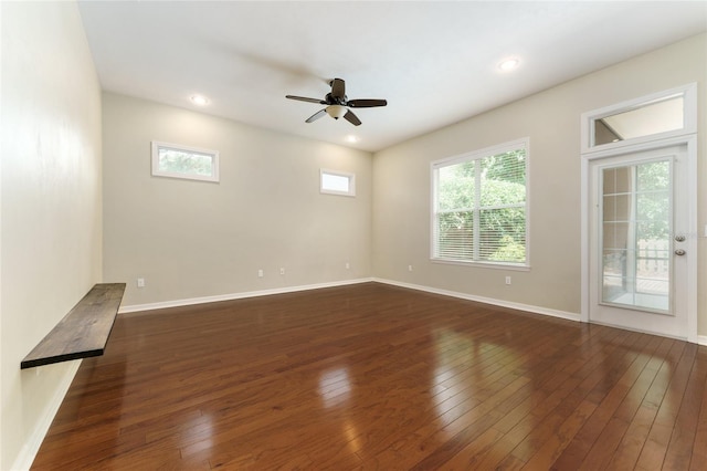 8650 SW 26th Ln, Gainesville, FL 32608 - empty room with dark wood-style flooring, ceiling fan, and recessed lighting