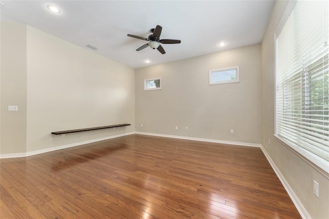 8650 SW 26th Ln, Gainesville, FL 32608 - spare room featuring hardwood / wood-style floors, a ceiling fan, and recessed lighting