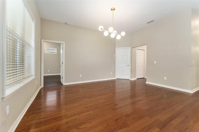 8650 SW 26th Ln, Gainesville, FL 32608 - unfurnished room with wood finished floors and a chandelier
