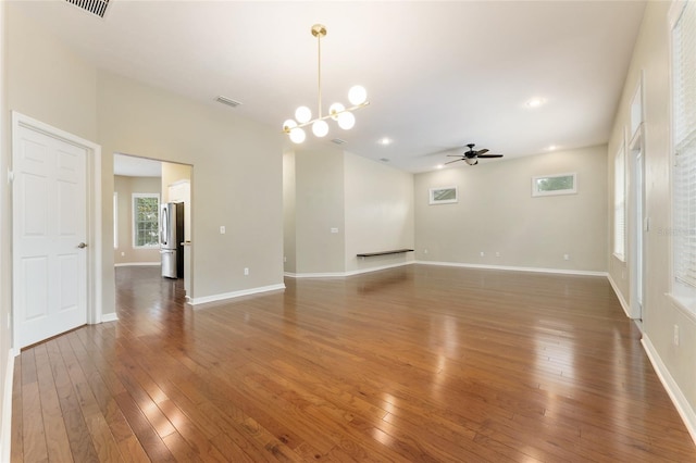 8650 SW 26th Ln, Gainesville, FL 32608 - unfurnished living room with a ceiling fan, hardwood / wood-style flooring, a chandelier, and recessed lighting
