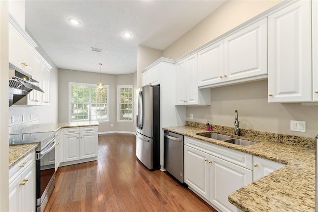 8650 SW 26th Ln, Gainesville, FL 32608 - kitchen featuring stainless steel appliances, exhaust hood, white cabinetry, dark wood finished floors, and recessed lighting