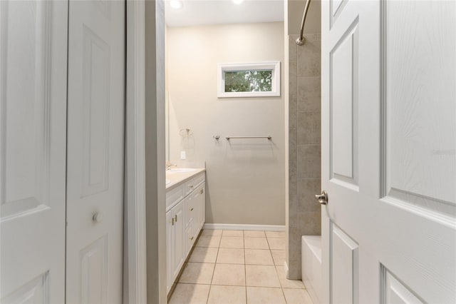 8650 SW 26th Ln, Gainesville, FL 32608 - bathroom featuring vanity, tile patterned flooring, and  shower combination
