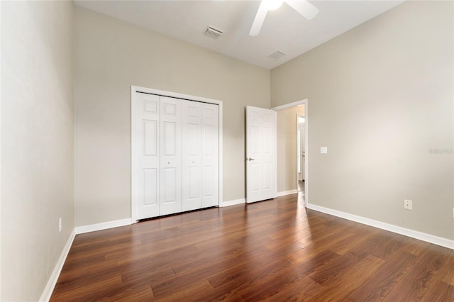 8650 SW 26th Ln, Gainesville, FL 32608 - unfurnished bedroom featuring wood finished floors, a closet, and a ceiling fan